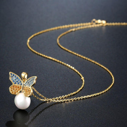 Sitting Golden Butterfly On Snow Pearl Necklace Pendant - KHAISTA Fashion Jewellery